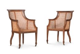 Y A PAIR OF EDWARDIAN MAHOGANY, SATINWOOD BANDED AND LINE INLAID BERGERE LIBRARY ARMCHAIRS