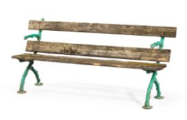 A CAST IRON RUSTIC GARDEN BENCH, IN THE MANNER OF MCLAREN, LATE 19TH CENTURY
