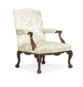 A GEORGE III CARVED MAHOGANY AND UPHOLSTERED OPEN ARMCHAIR, CIRCA 1765