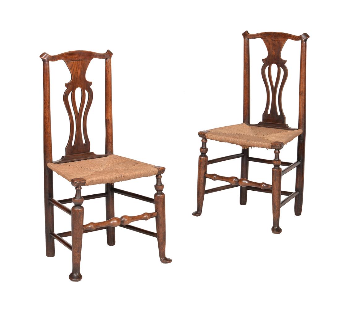 A PAIR OF GEORGE III ELM AND RUSH SEATED SIDE CHAIRS