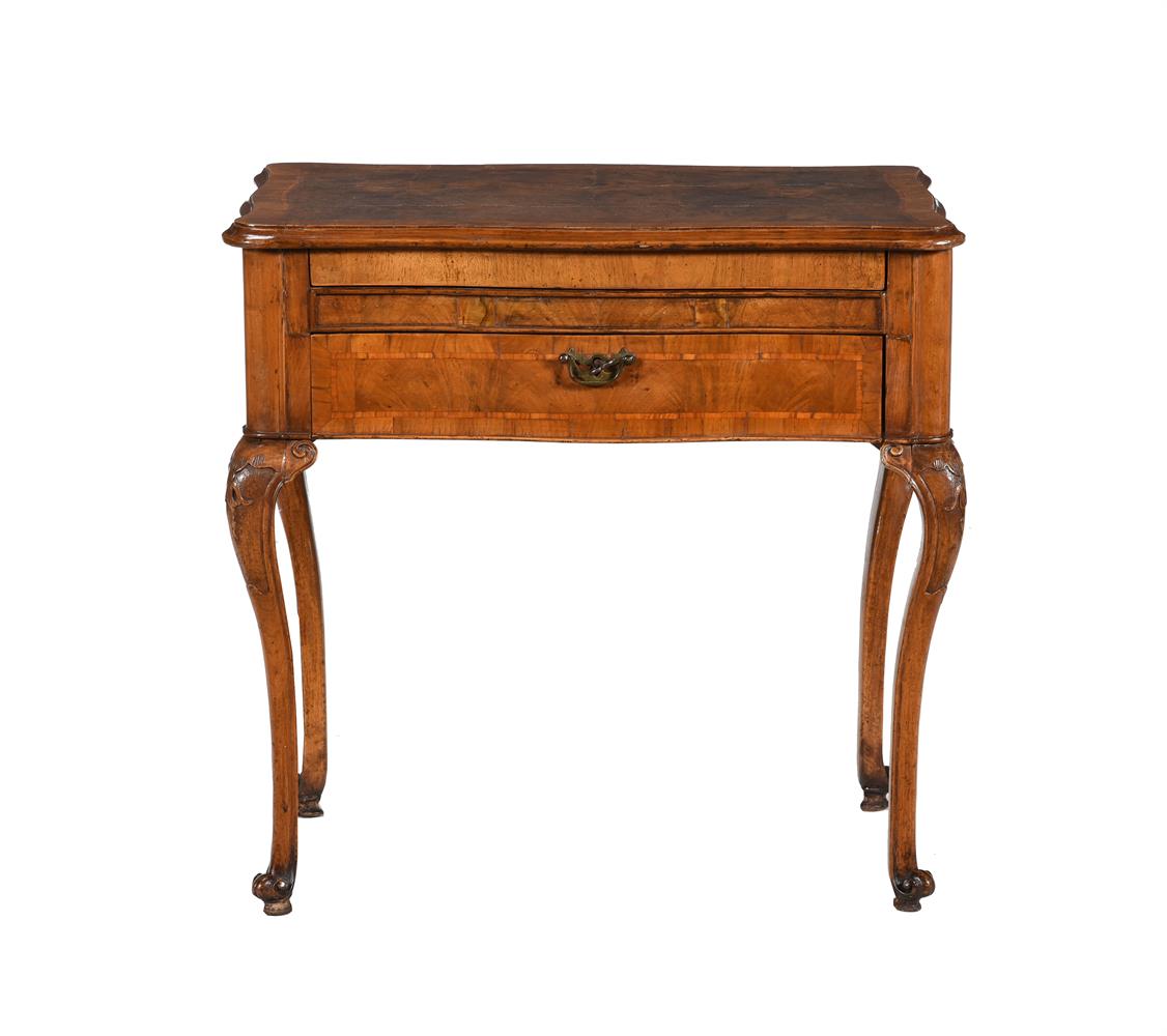 A WALNUT AND CROSSBANDED DRESSING TABLE IN QUEEN ANNE STYLE