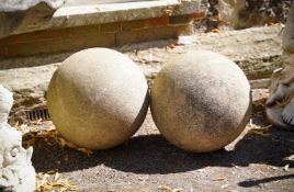 A PAIR OF COMPOSITION STONE SPHERES