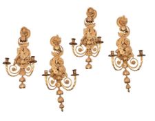 A SET OF FOUR CARVED GILTWOOD WALL APPLIQUES