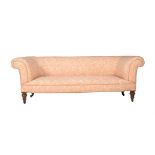 A VICTORIAN WALNUT AND UPHOLSTERED SOFA