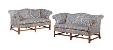 A PAIR OF MAHOGANY AND UPHOLSTERED SOFAS IN GEORGE III STYLE