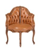 A FRENCH WALNUT AND LEATHER UPHOLSTERED CORNER CHAIR IN LOUIS XVI STYLE