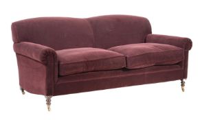 A PORT COLOURED VELVET UPHOLSTERED TWO SEAT SOFA