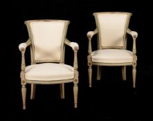 A PAIR OF FRENCH PAINTED AND UPHOLSTERED ARMCHAIRS IN EARLY 19TH CENTURY STYLE