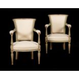 A PAIR OF FRENCH PAINTED AND UPHOLSTERED ARMCHAIRS IN EARLY 19TH CENTURY STYLE