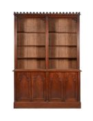 A VICTORIAN STAINED OAK BOOKCASE IN GOTHIC TASTE