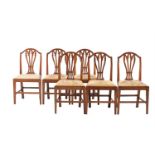 A SET OF SIX GEORGE III ELM DINING CHAIRS