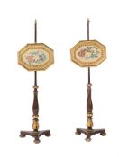 A PAIR OF GEORGE IV SIMULATED ROSEWOOD AND PARCEL GILT POLESCREENS