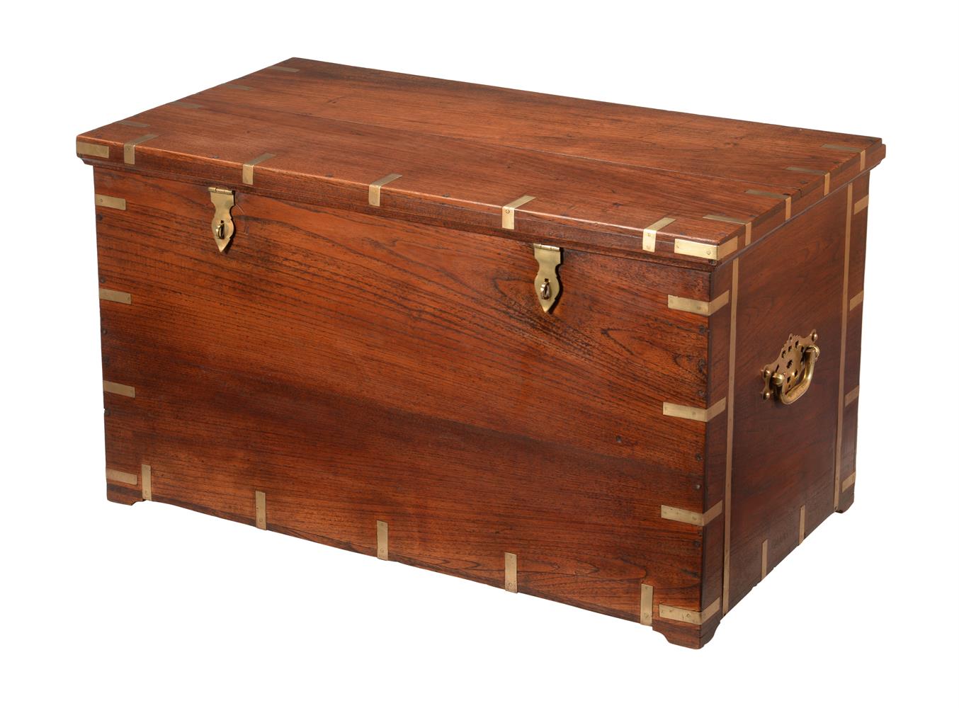 A TEAK AND BRASS BOUND TRUNK OR SILVER CHEST