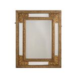 A PAINTED AND GILT METAL MOUNTED WALL MIRROR