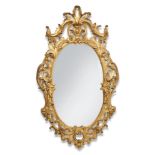A GILTWOOD AND COMPOSITION WALL MIRROR IN GEORGE III STYLE, 19TH CENTURY