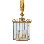 A GILT METAL AND EIGHT GLASS HALL LANTERN IN THE REGENCY STYLE, EARLY 20TH CENTURY AND LATER