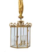 A GILT METAL AND EIGHT GLASS HALL LANTERN IN THE REGENCY STYLE, EARLY 20TH CENTURY AND LATER