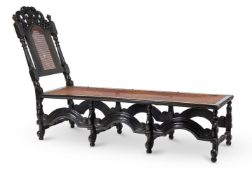 AN EBONISED AND CANEWORK DAY BED, LATE 17TH CENTURY AND LATER
