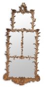 AN EARLY GEORGE III CARVED PINE AND CARTON PIERRE WALL MIRROR, CIRCA 1760