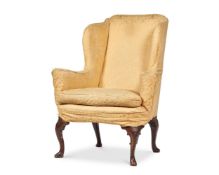 A WALNUT AND UPHOLSTERED WING ARMCHAIR, CIRCA 1740 AND LATER