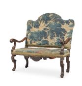 A CONTINENTAL WALNUT AND TAPESTRY UPHOLSTERED SETTEE, LATE 17TH AND LATER