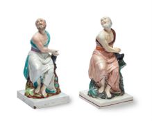 TWO SIMILAR STAFFORDSHIRE PEARLWARE FIGURES OF ELIJA AND THE RAVEN, CIRCA 1820