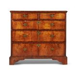 A WALNUT AND FEATHER BANDED CHEST OF DRAWERS, CIRCA 1740 AND LATER