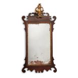 A MAHOGANY AND PARCEL GILT WALL MIRROR, CIRCA 1740 AND LATER