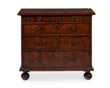 A WALNUT CHEST OF DRAWERS , OF 'BACHELOR' TYPE, EARLY 18TH CENTURY AND LATER
