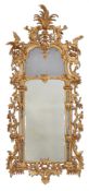 A CARVED GILTWOOD MIRROR, LATE 18TH/ EARLY 19TH CENTURY