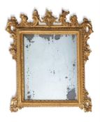 A NORTH ITALIAN GILTWOOD TOILET MIRROR, 19TH CENTURYwith rectangular plate in foliate carved surroun