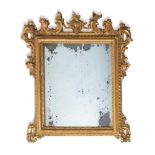 A NORTH ITALIAN GILTWOOD TOILET MIRROR, 19TH CENTURYwith rectangular plate in foliate carved surroun