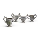 A SET OF FOUR LEAD TWIN HANDLED GARDEN URNS, PROBABLY LATE 19TH CENTURY