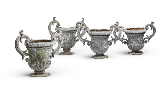 A SET OF FOUR LEAD TWIN HANDLED GARDEN URNS, PROBABLY LATE 19TH CENTURY