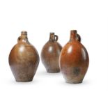 THREE SUBSTANTIAL GERMAN SALT-GLAZED STONEWARE FLASKS, 17TH CENTURY