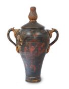 A BLACK AND GILT CHINOISERIE DECOUPAGE DECORATED TERRACOTTA VASE, 19TH CENTURY