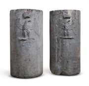 A PAIR OF FRENCH CARVED GREY STONE CYLINDRICAL PEDESTALS, 18TH OR 19TH CENTURY