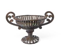 A STRAPWORK IRON TWO HANDLED URN MODERN