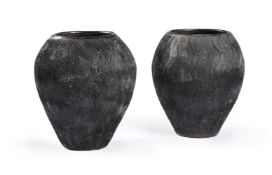 TWO SIMILAR TERRACOTTA COLD-PAINTED BLACK OVOID VASESMODERNwith vertical incised wave decoration3