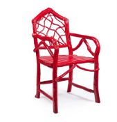A MOROCCAN RED PAINTED ROOT-FORM OPEN ARMCHAIR, 'NOW ON THE OCEAN'