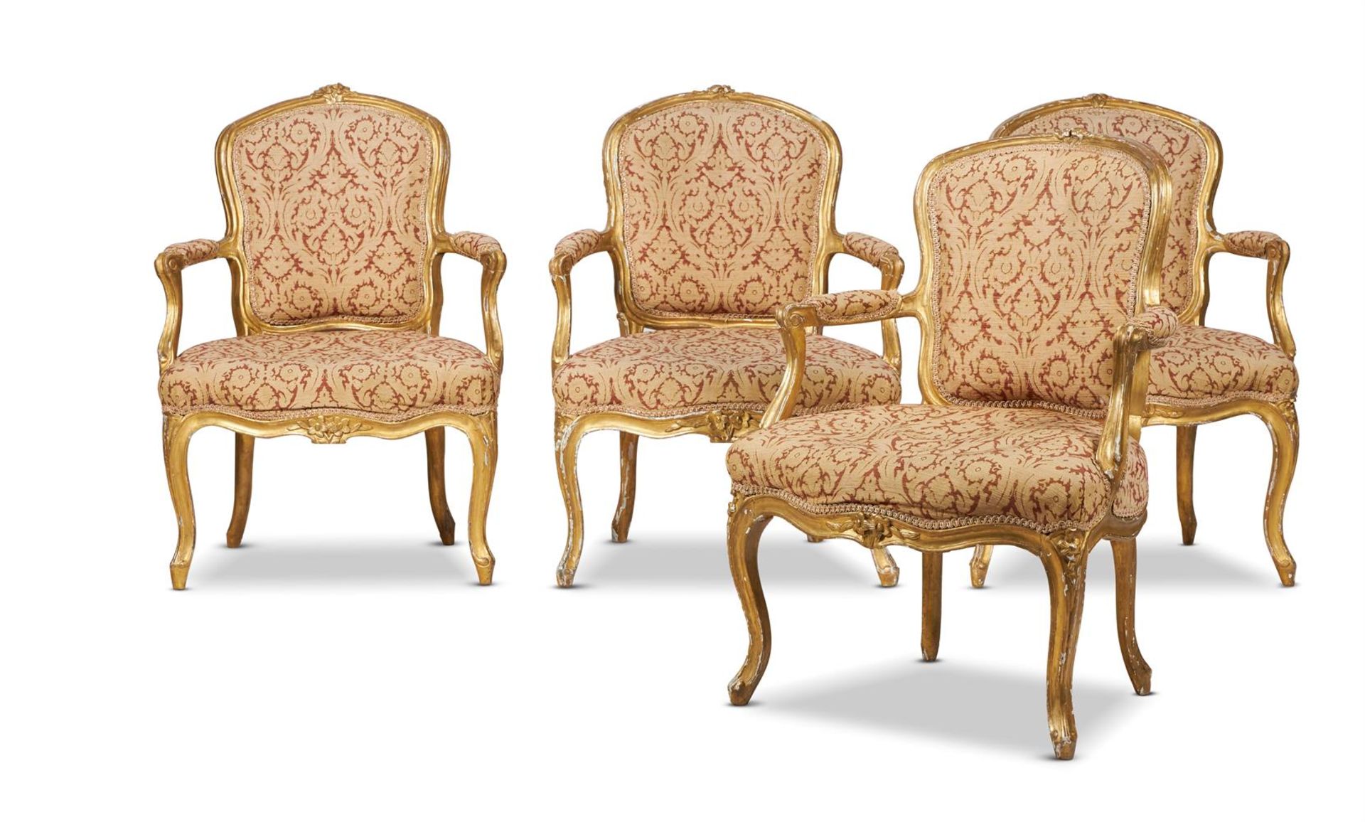 A HARLEQUIN SET OF EIGHT LOUIS XV GILTWOOD FAUTEUILS, CIRCA 1760-80