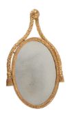 A GILTWOOD OVAL WALL MIRROR IN 18TH CENTURY STYLE