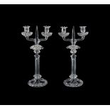 A PAIR OF MOULDED GLASS TWIN BRANCH CANDELABRA OF BACCARAT TYPE