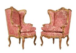 A PAIR OF CONTINENTAL, PROBABLY ITALIAN, GILTWOOD AND UPHOLSTERED ARMCHAIRS