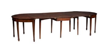 A MAHOGANY D-END DINING TABLE