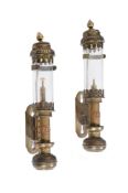 A pair of brass railway carriage candle lamps having glass shades.