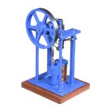 A well-engineered model of an over-type vertical live steam mill engine