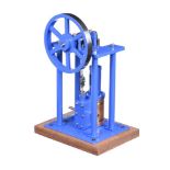 A well-engineered model of an over-type vertical live steam mill engine