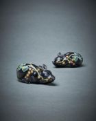 A pair of Dutch Delft black glazed models of 'tree shrews'