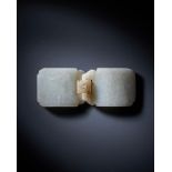 A Chinese mottled-white jade belt buckle